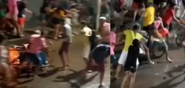 Vídeo : Homem pega porrada de uma galera durante bloco de rua e no final, ainda leva uma facada!