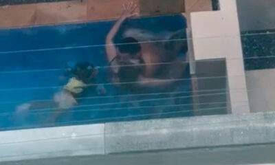 Vídeo : Casal é filmado oferecendo bebida alcoólica a criança e mantendo relações sexuais em piscina de condomínio